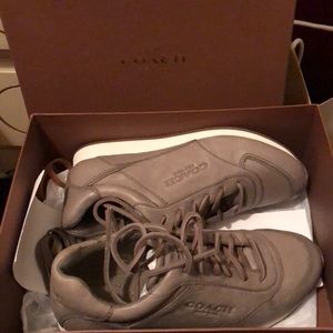 Brand new. Never worn. Coach leather sneakers